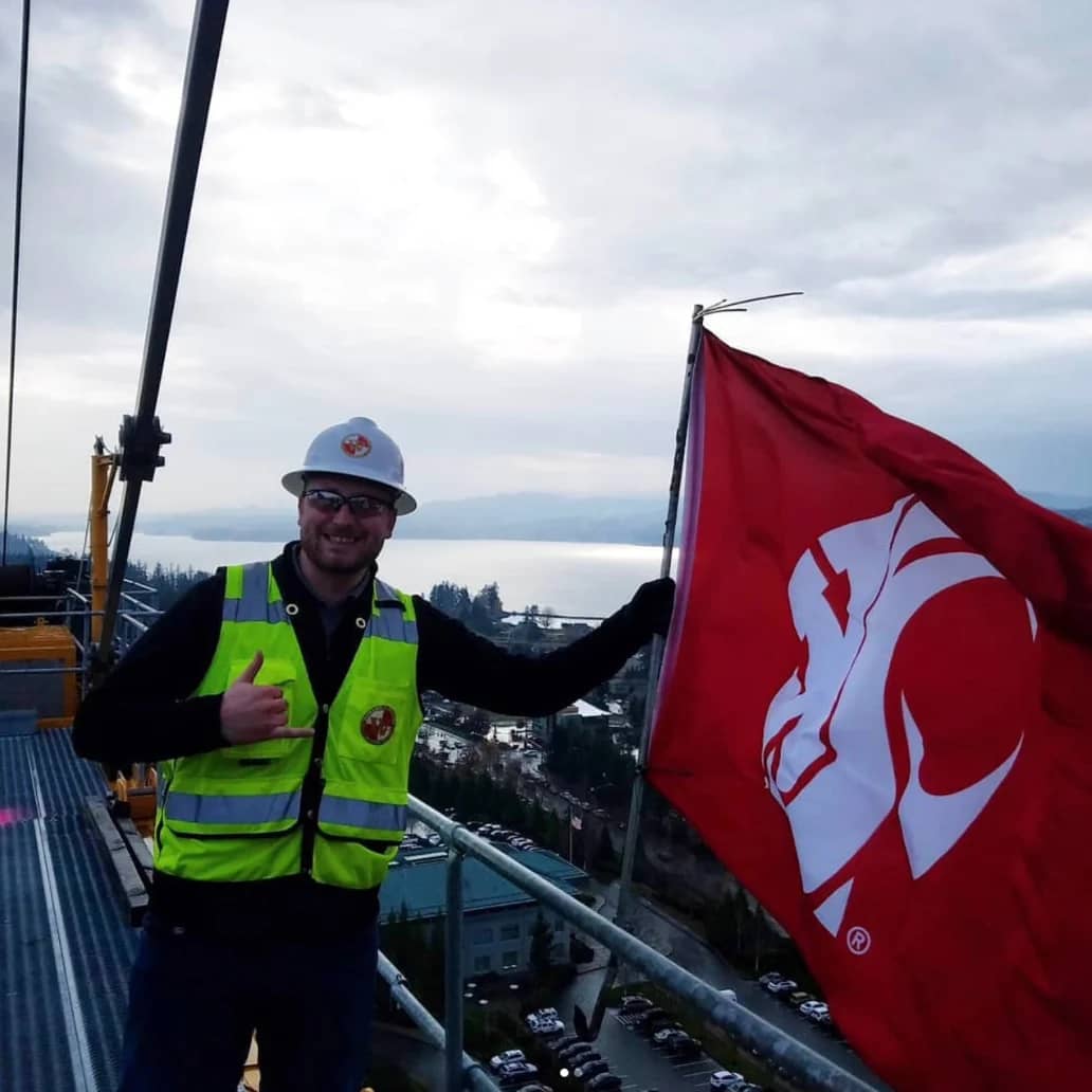 Hanging the WSU flag on a tower crane at St. Michael Medical Center